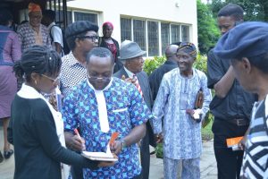 Fr. Adodo interacting with participants after the seminar